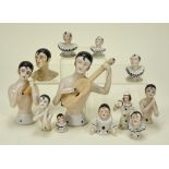 Collection of glazed china Pierrot half dolls,