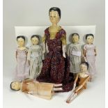 A collection of painted wooden peg dolls, circa 1900,