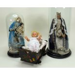 A pair of wax Madonna figures in glass domes, southern European 20th century,