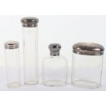 Four early 20th century silver and glass dressing bottles, including Mappin & Webb