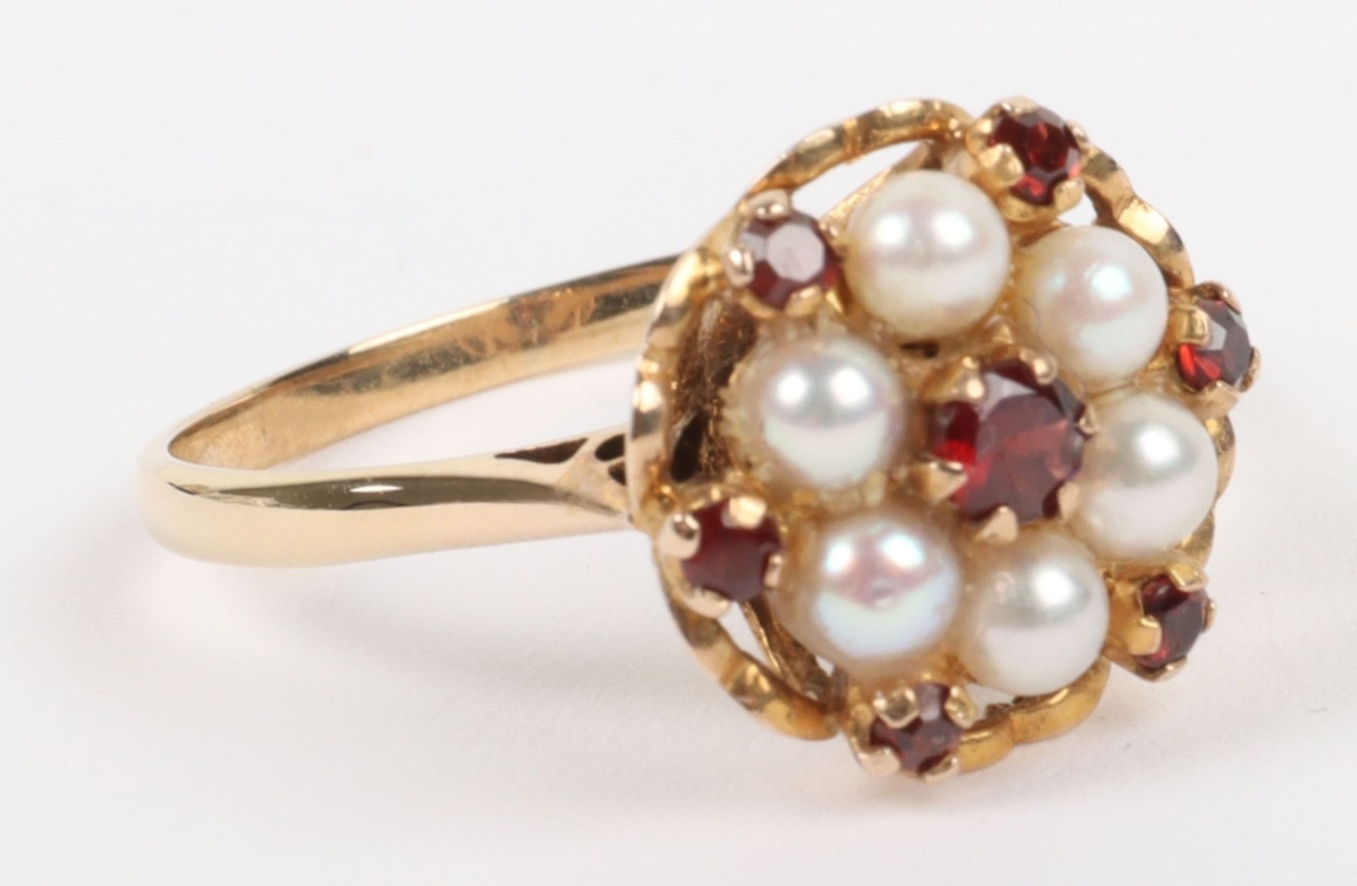 A 9ct gold, pearl and garnet cluster ring