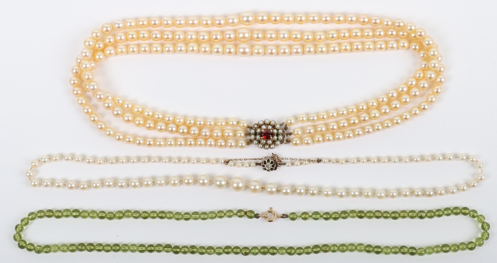 A single row cultured pearl necklace with diamond and 9ct (unmarked) clasp