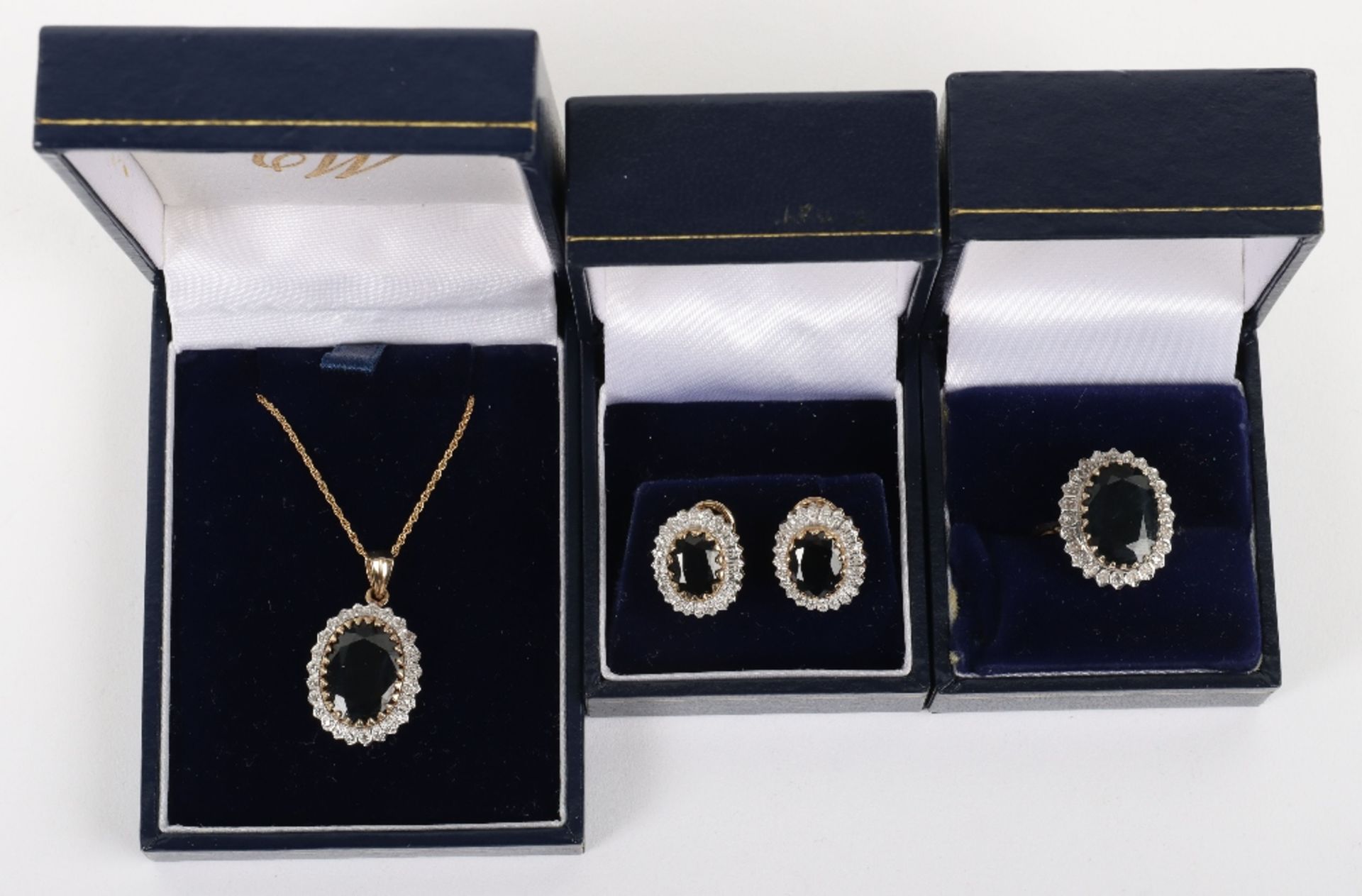 A set of three 9ct diamond and sapphire including ring, pendant necklace and earrings