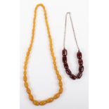 A cherry amber bead necklace on silver chain