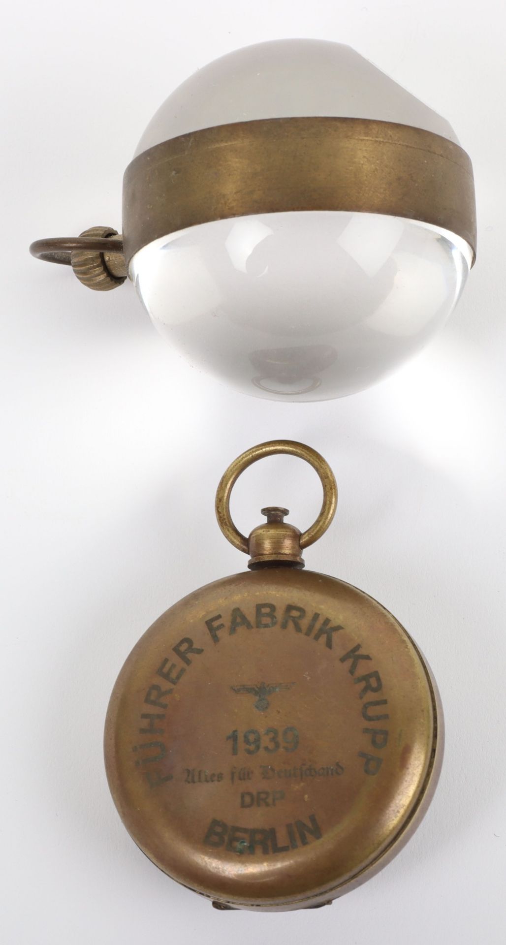 An Omega globe desk clock, 5cm