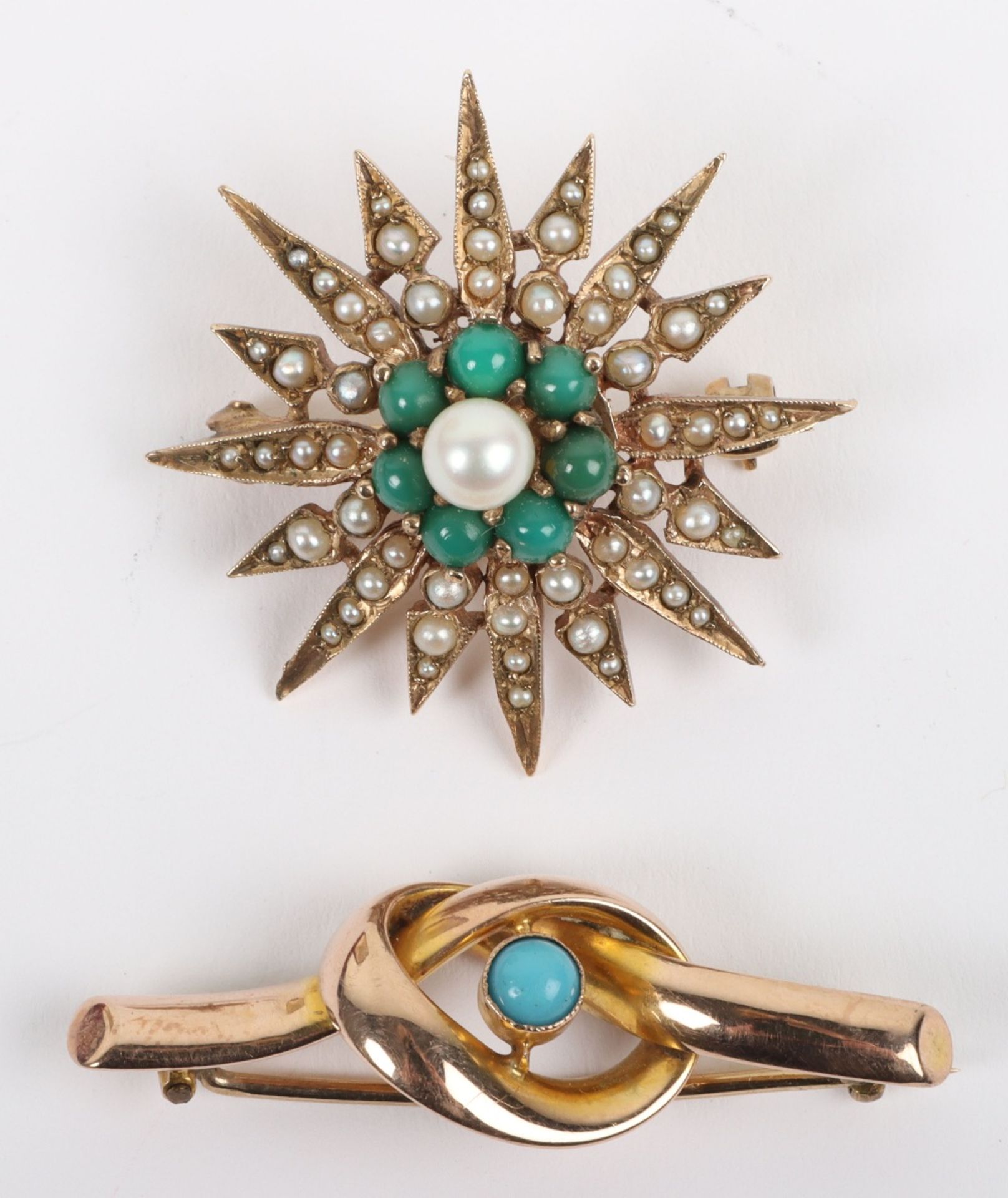 A 9ct gold and turquoise knot design brooch