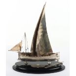 An early 20th century silver plated trophy of a sailing boat