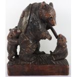 A Japanese wood carved group of bear and two cubs