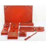 A 20th century Japanese red lacquer desk set