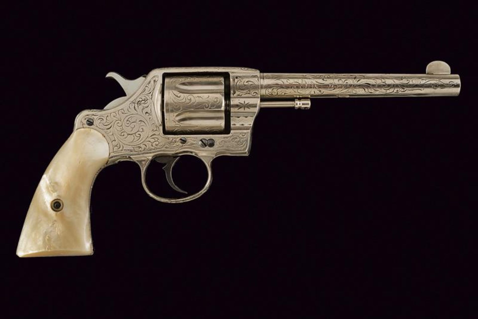 An engraved 1889 model Colt revolver