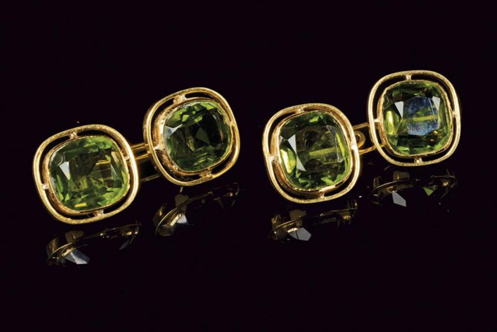 18 kt gold cufflinks set with green rhinestones