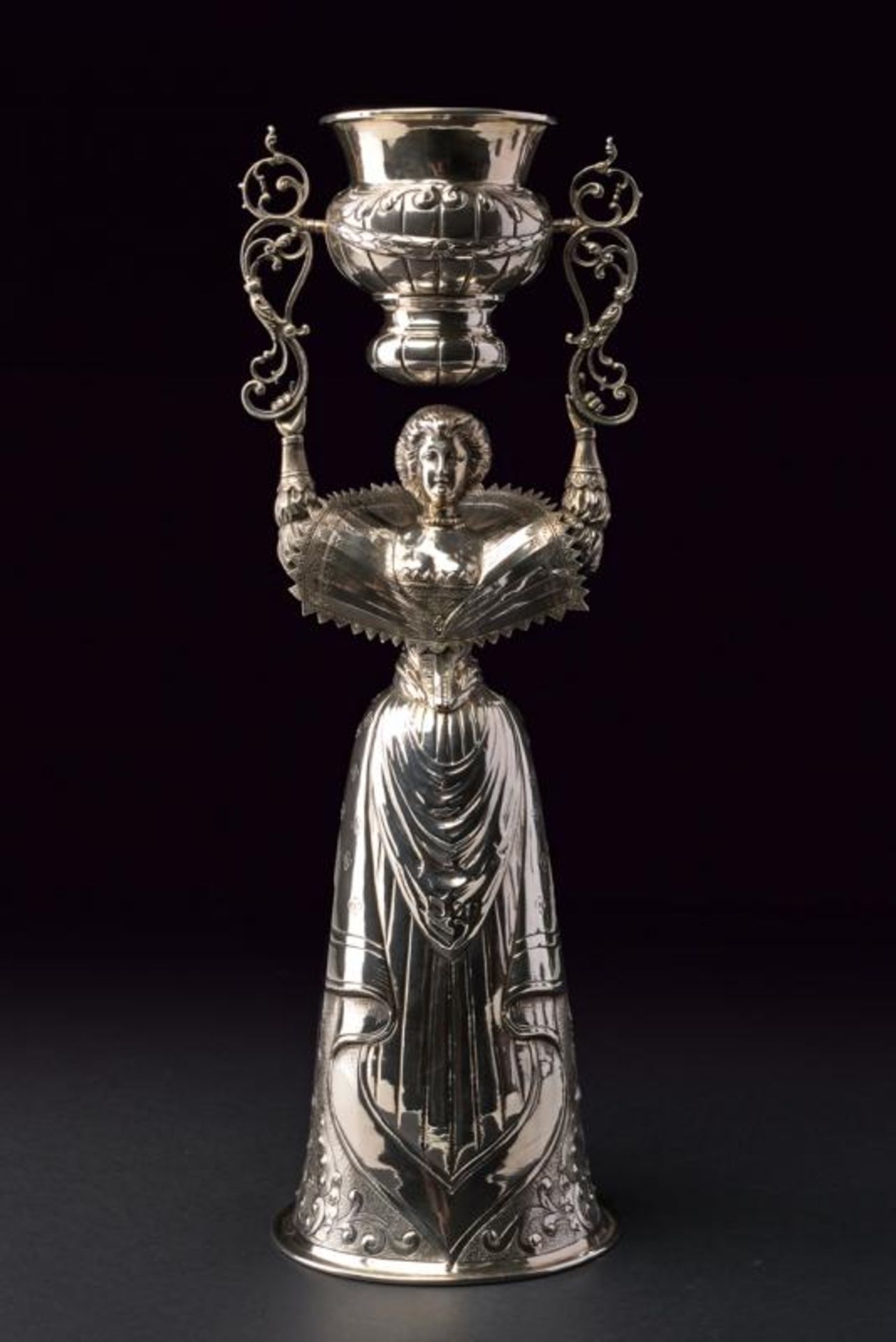 A large silver wedding cup