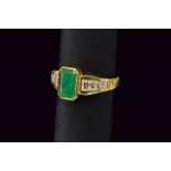 Emerald and diamond gold ring