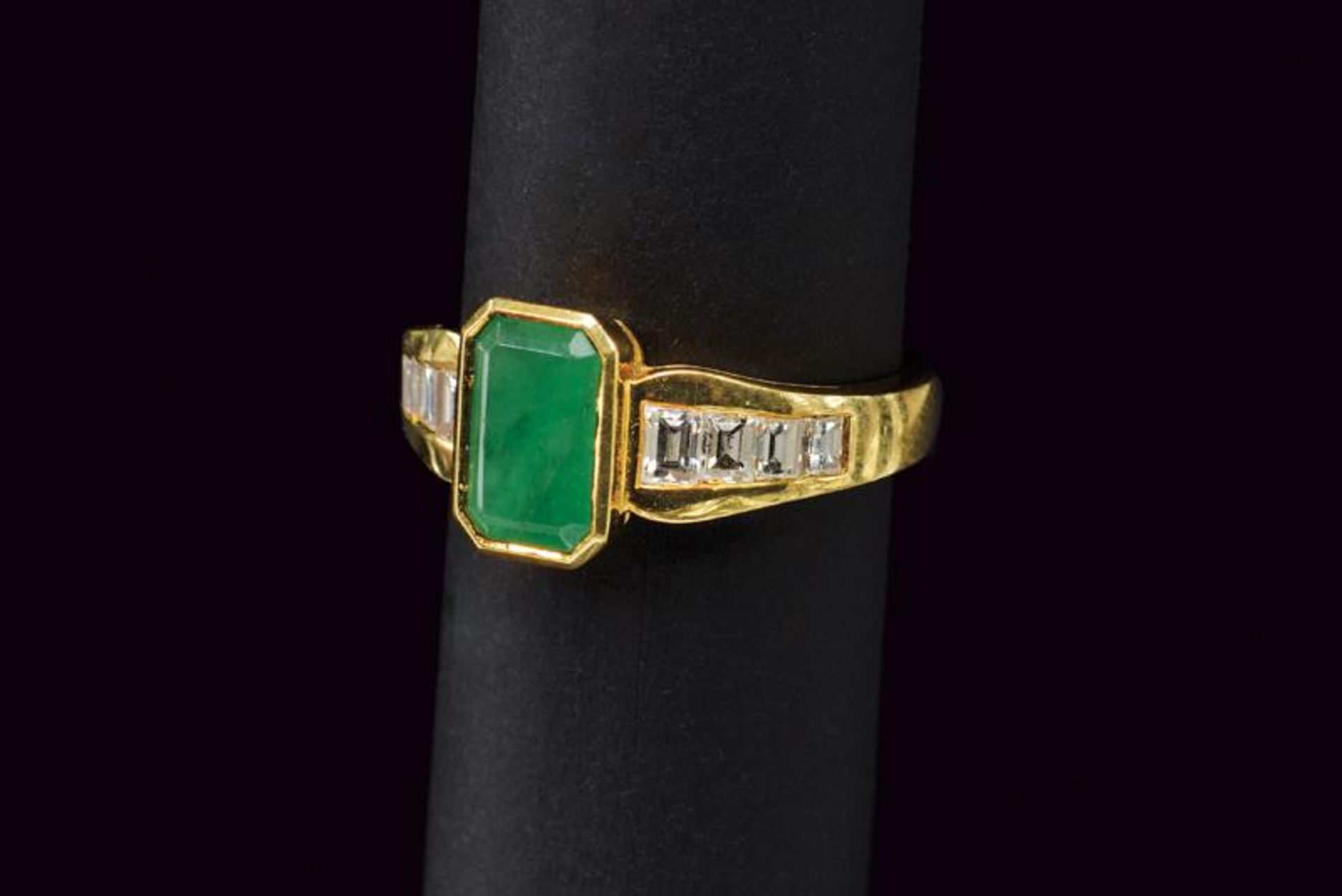 Emerald and diamond gold ring