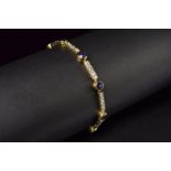 Two-color gold bracelet set with diamonds and sapphires