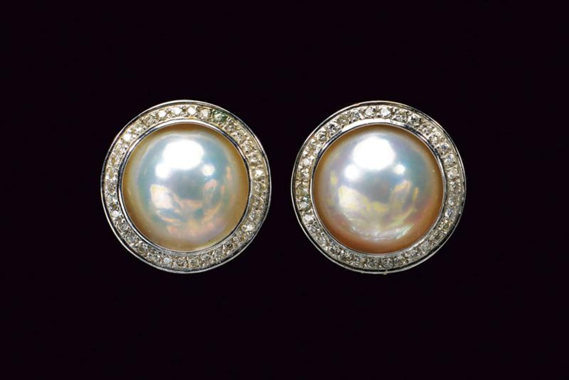 Pair of clip earrings with mab pearls and diamonds