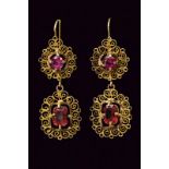 Gold filigree earrings set with rubies