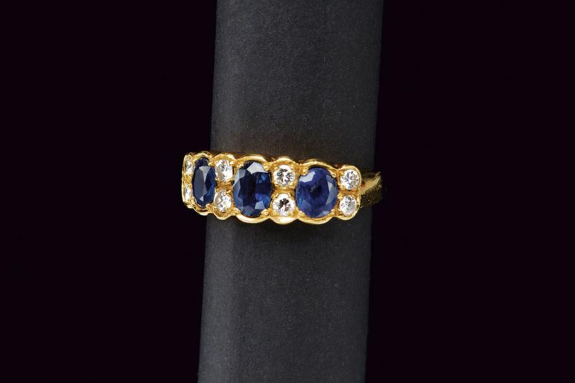 Diamond and sapphire gold band ring