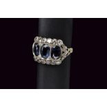 White gold retro ring with diamonds and sapphires
