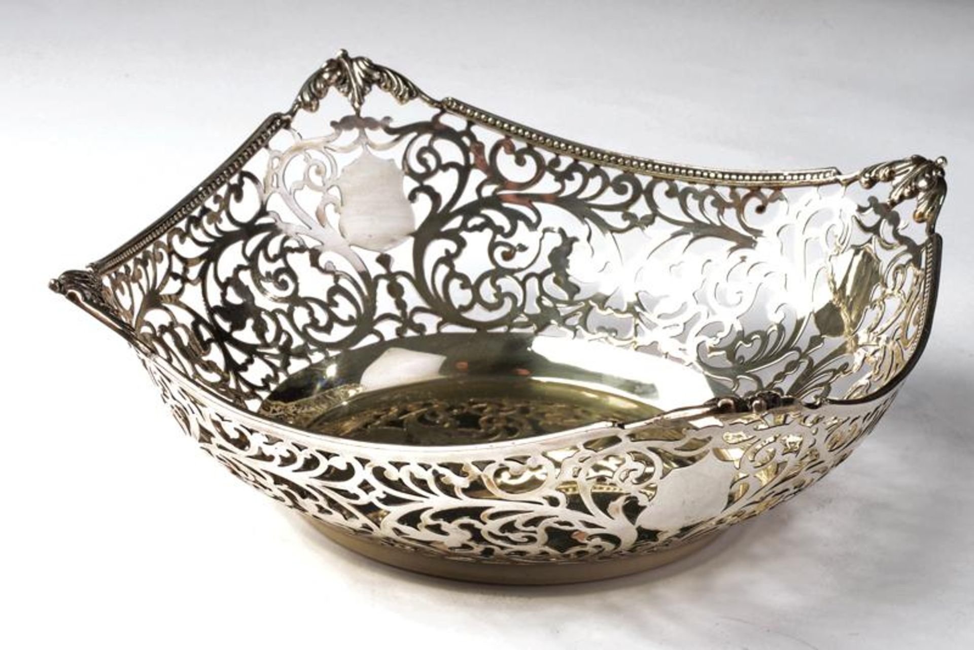 A silver cake basket