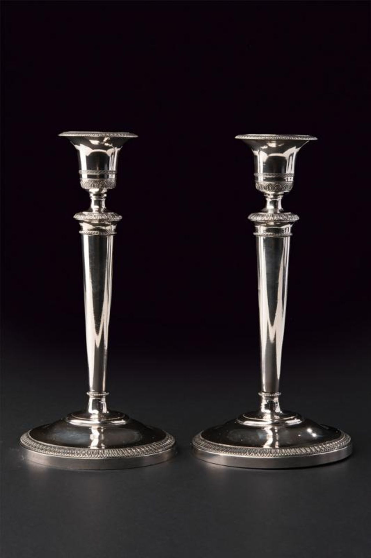 A silver pair of candlesticks