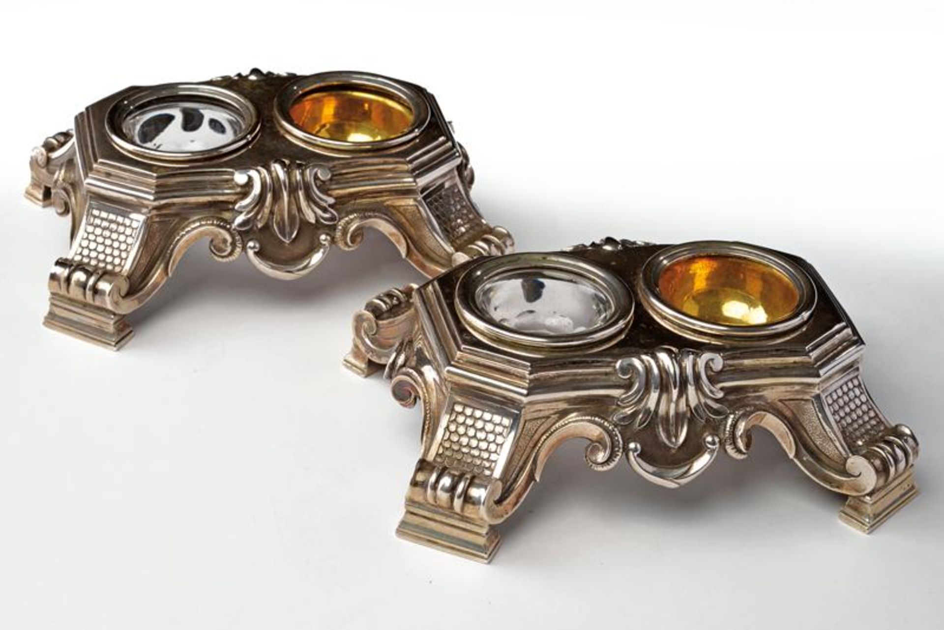 A silver pair of double salt cellars
