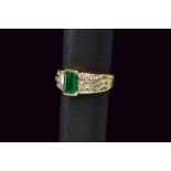 Emerald and diamond gold ring