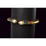 Gold and enamel bangle with spring opening