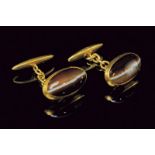 A pair of tiger’s eye 18kt yellow gold cufflinks