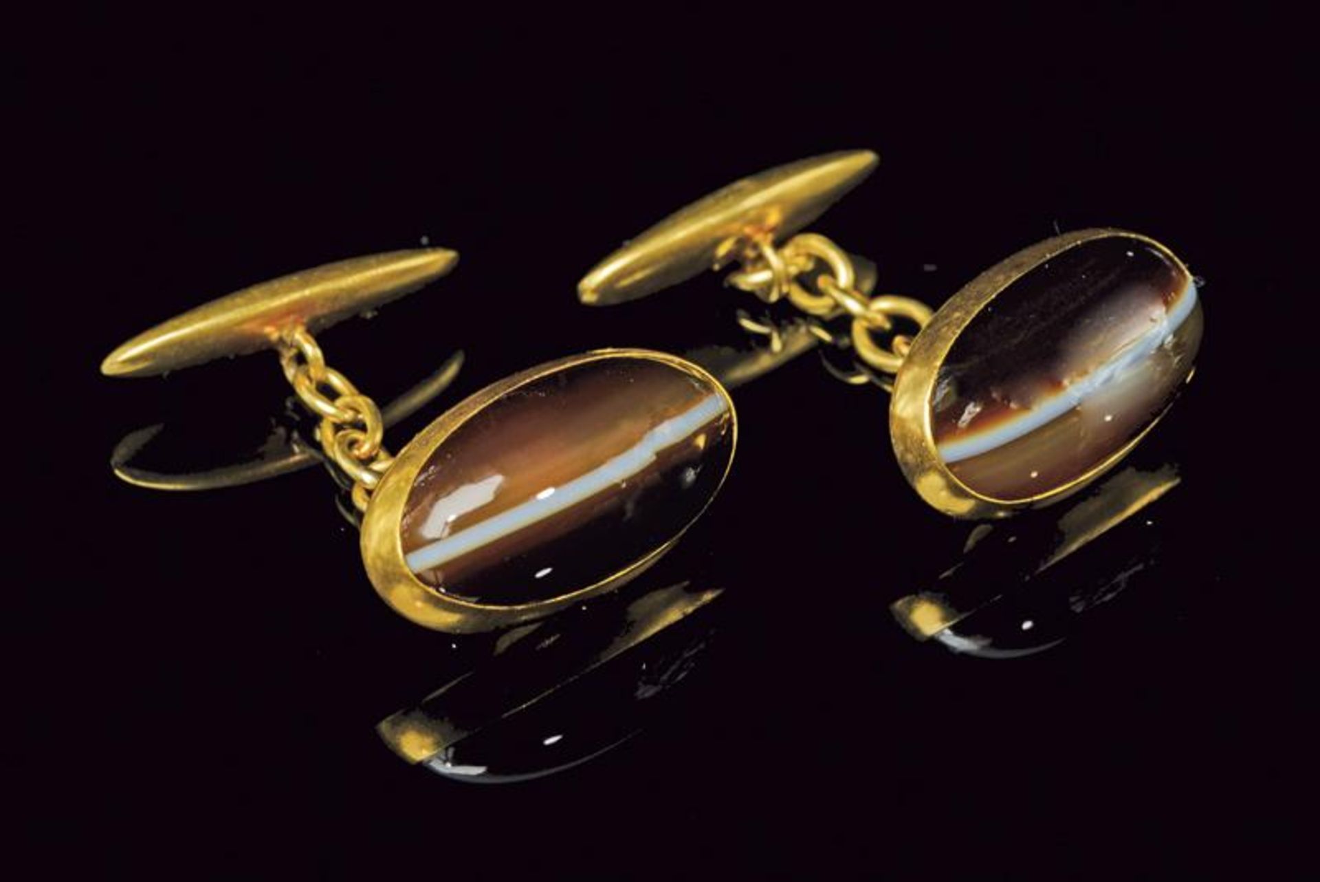 A pair of tiger’s eye 18kt yellow gold cufflinks