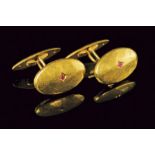 18 kt gold cufflinks with tiny rubies