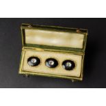 Set of three gold, enamel and diamond buttons