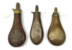 Three Victorian Sykes Patent copper and brass powder flasks, one embossed with stylised shells, one