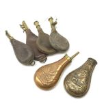 Four Victorian leather and brass shot flasks; Victorian copper powder flask embossed with stags in a