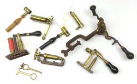 Ten predominantly 19th century brass cartridge making tools comprising Jeffries re-loader, James Dix