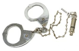 Pair of 1960's Hiatt chromium plated handcuffs with key and a 'Metropolitan' whistle