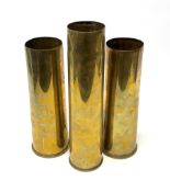 Three early 20th century plain brass shell cases, dated 1911, 1915 and 1916, tallest H35cm (3)