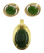 Gold oval jade pendant stamped 18KT and pair of 14ct gold jade stud earrings