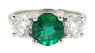 18ct white gold three stone round emerald and round brilliant cut diamond ring, stamped 750, emerald