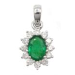 White gold oval emerald and round brilliant cut diamond cluster pendant, stamped 18K, emerald approx