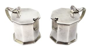 Two silver mustard pots, with blue glass liners by Stokes & Ireland Ltd, Chester 1922/23