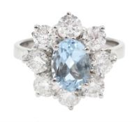 18ct white gold oval aquamarine and round brilliant cut diamond cluster ring, hallmarked, aquamarine