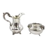 Victorian silver milk jug, scroll handle and on foliate bracket feet by John & Henry Lias, London 1