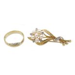 White and yellow gold three stone diamond ring and a gold pearl and diamond flower design brooch, bo
