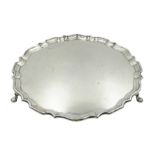 Silver shaped circular salver on three hoof feet by Hawksworth, Eyre & Co Ltd, London 1922, approx 3