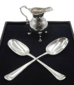 George III silver cream jug, leaf capped scroll handle, raised on three trefoil feet, London 1775, G