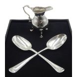 George III silver cream jug, leaf capped scroll handle, raised on three trefoil feet, London 1775, G