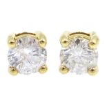 Pair of 18ct gold diamond stud earrings, stamped 750, total diamond weight 0.64 carat