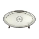 George III silver teapot stand, engraved initial decoration, on four raised reeded feet, by Peter, A