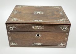 A Victorian rosewood vanity box, with inlaid foliate mother of pearl decoration, the hinged cover op